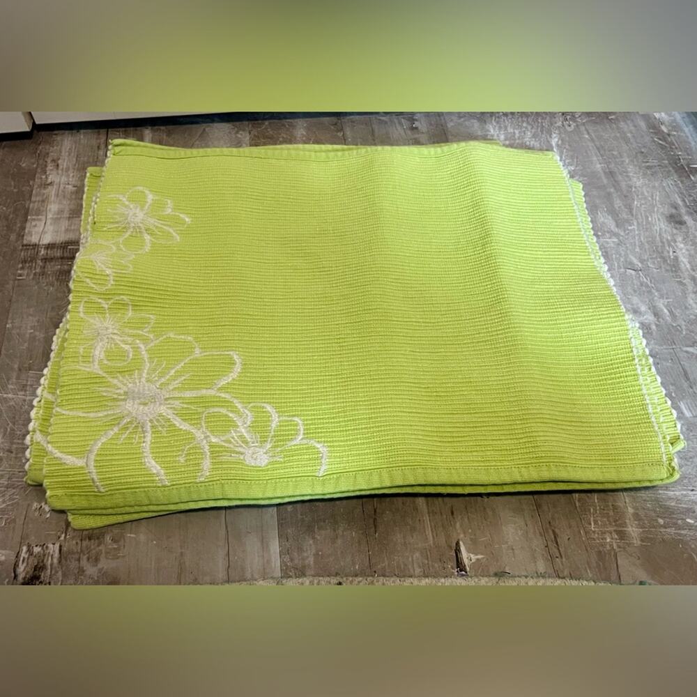 Lime green and white embroidered fabric placemats